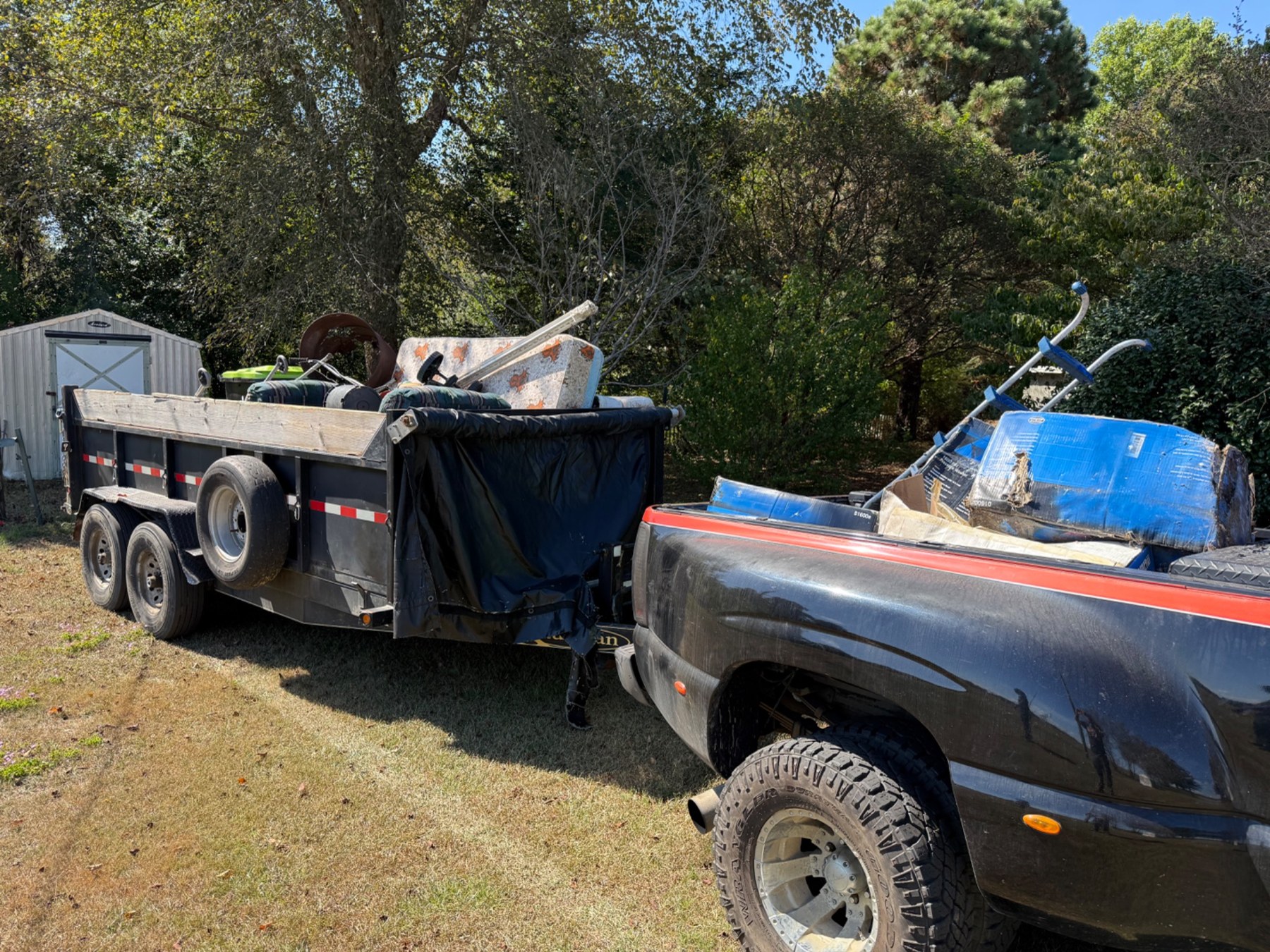 Truck and trailer loaded with debris